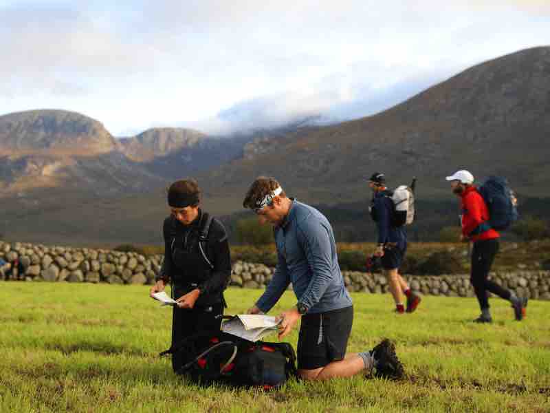 Runners marking up maps